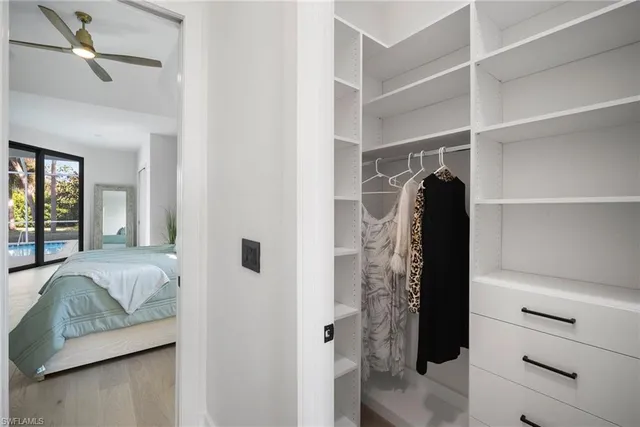 a living room with furniture and a walk in closet