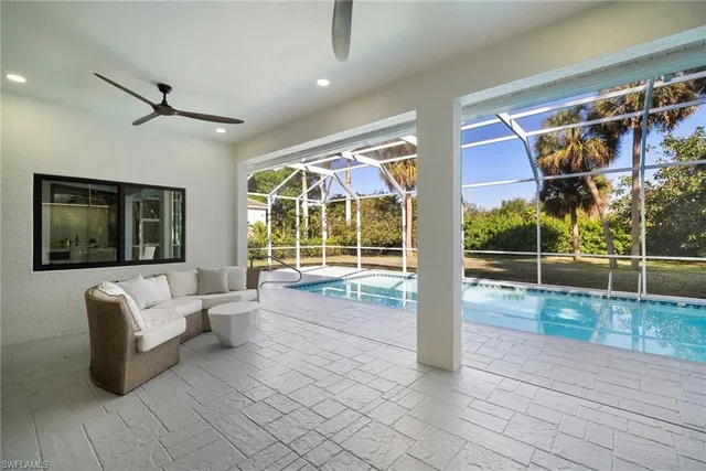 a view of a living room and a large window