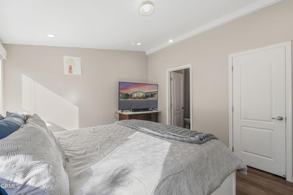 250 East Telegraph Road, Unit 155 Fillmore, CA 93015 - Photo 18 of 39 a bedroom with a bed and a television
