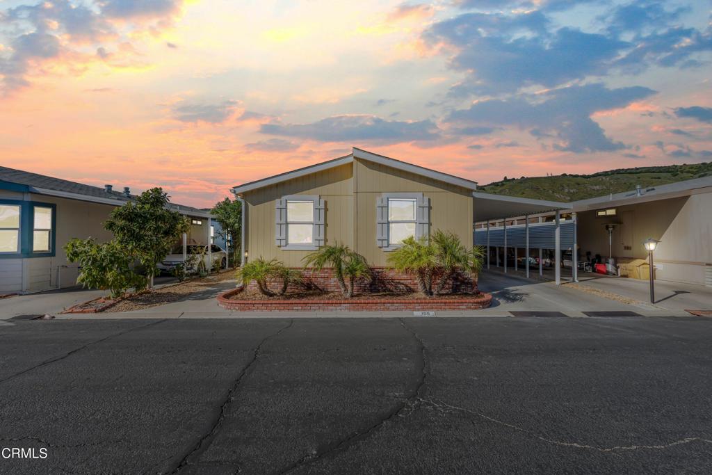 250 East Telegraph Road, Unit 155 Fillmore, CA 93015 - Photo 2 of 39 a front view of house with yard and green space