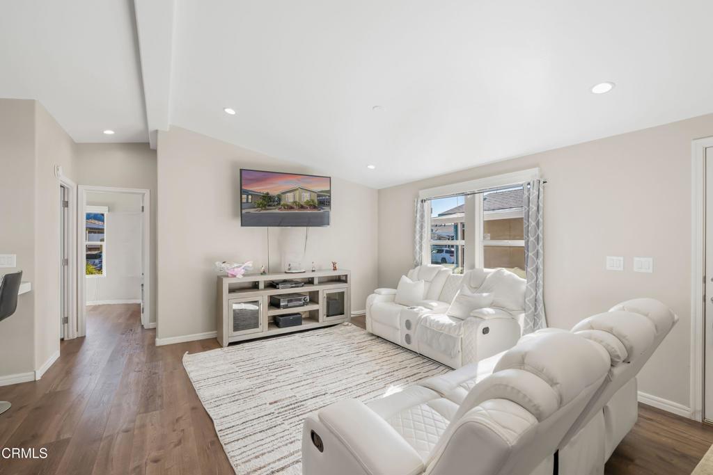 250 East Telegraph Road, Unit 155 Fillmore, CA 93015 - Photo 4 of 39 a bedroom with furniture and a flat screen tv