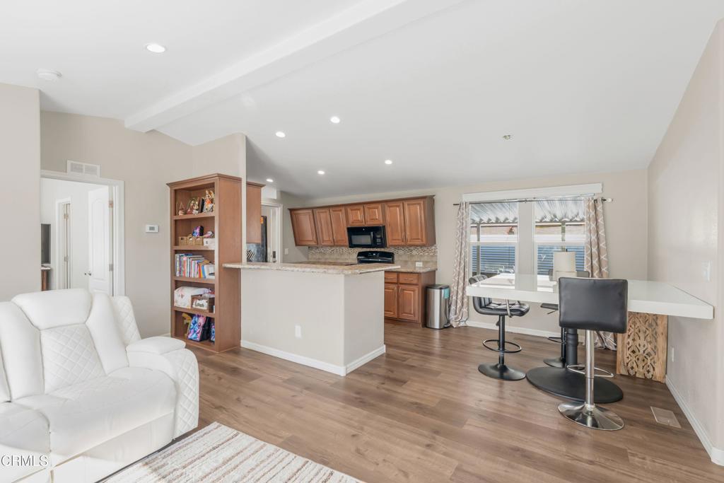 250 East Telegraph Road, Unit 155 Fillmore, CA 93015 - Photo 6 of 39 a living room with furniture and a kitchen view