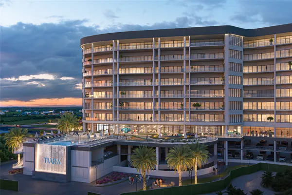 a front view of a building with outdoor space and seating