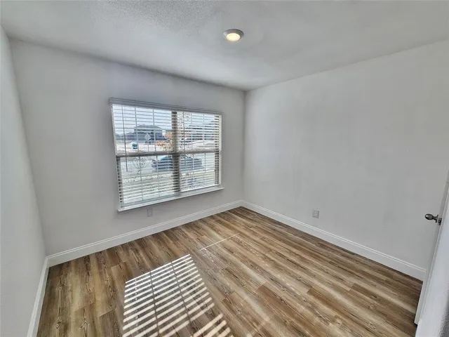 a view of a bathroom with wooden floor