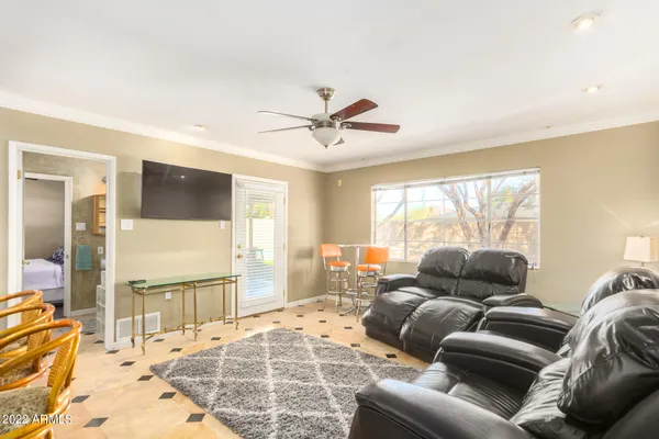 a living room with furniture and a large window