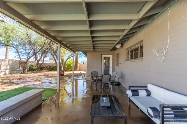 a view of a patio with wooden floor