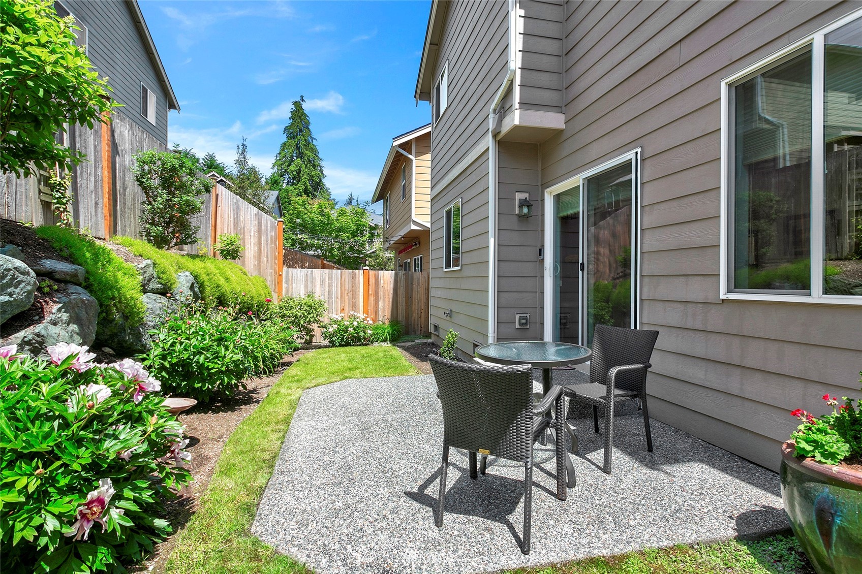 230 161st Place Southeast Bothell, WA 98012 - Photo 20 of 22 a view of a house with backyard sitting area and garden