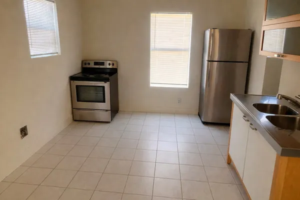 a room with a sink and cabinets