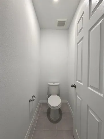 a front view of house with yard and garage