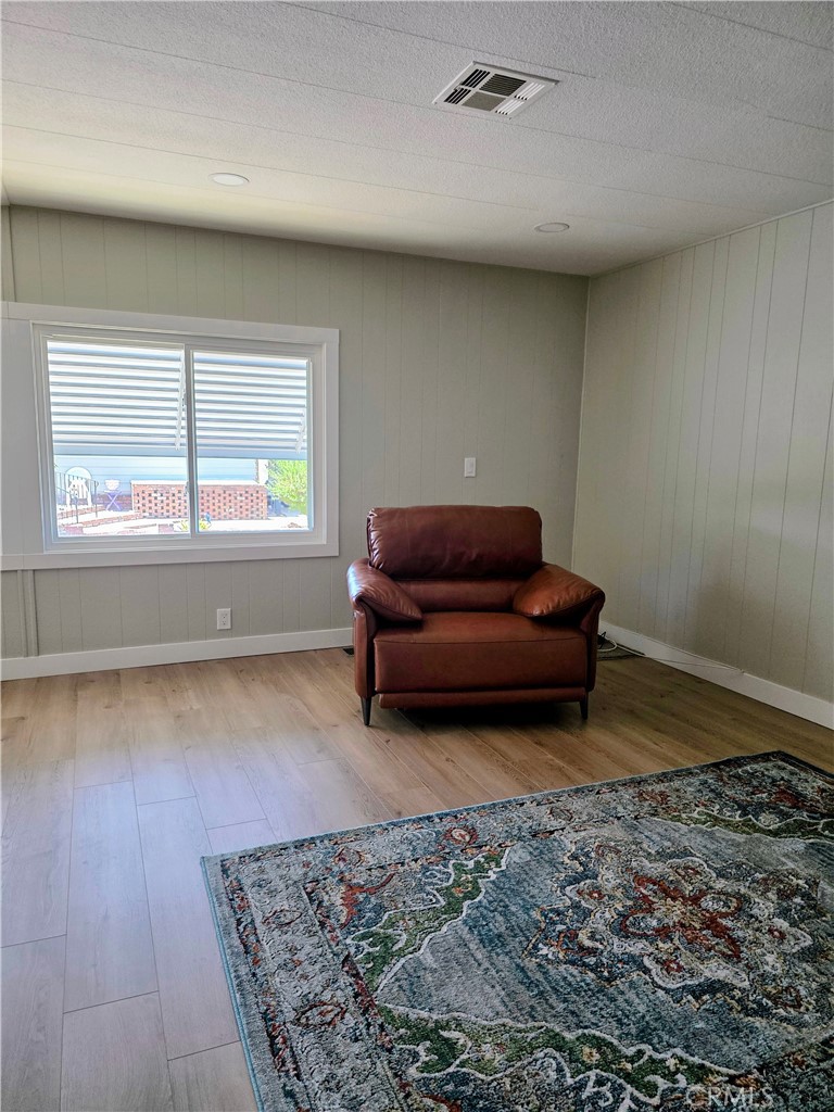 620 Lake Ridge Way, Unit 45 La Habra, CA 90631 - Photo 11 of 21 wooden floor in an empty room with a window