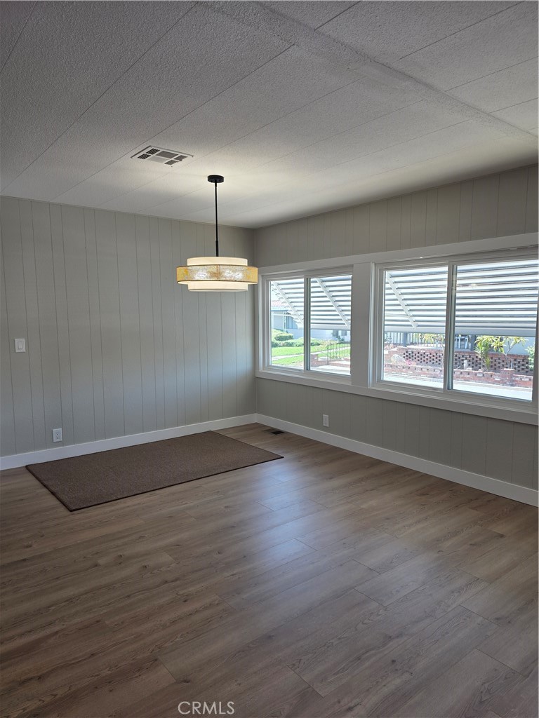 620 Lake Ridge Way, Unit 45 La Habra, CA 90631 - Photo 12 of 21 an empty room with wooden floor and windows