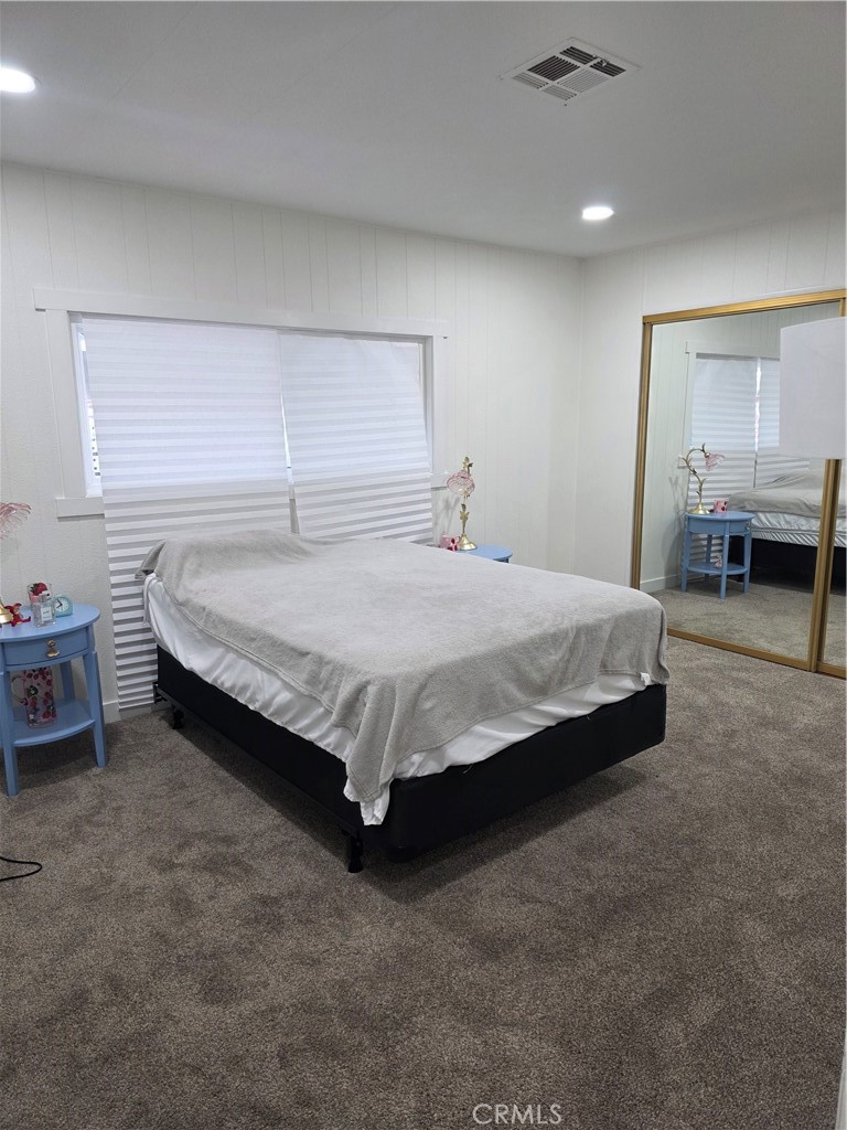 620 Lake Ridge Way, Unit 45 La Habra, CA 90631 - Photo 14 of 21 a bedroom with a bed and a table