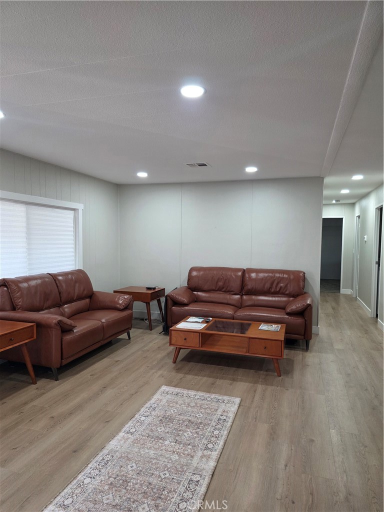 620 Lake Ridge Way, Unit 45 La Habra, CA 90631 - Photo 8 of 21 a living room with furniture and a couch