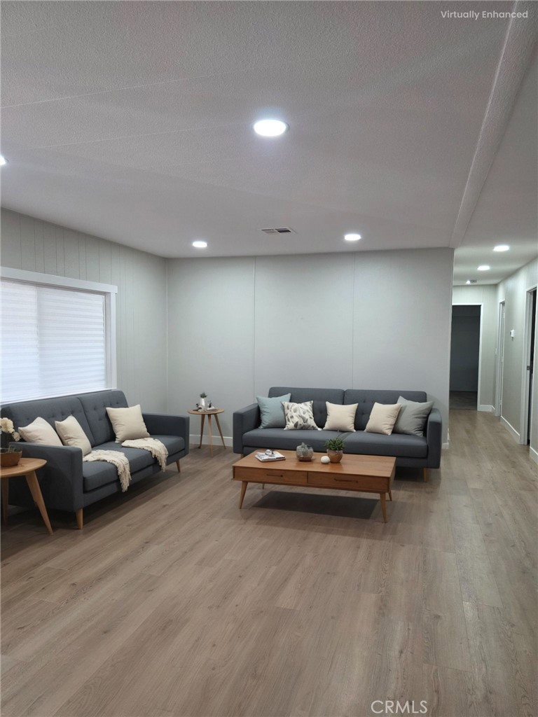 620 Lake Ridge Way, Unit 45 La Habra, CA 90631 - Photo 9 of 21 a living room with furniture and wooden floor