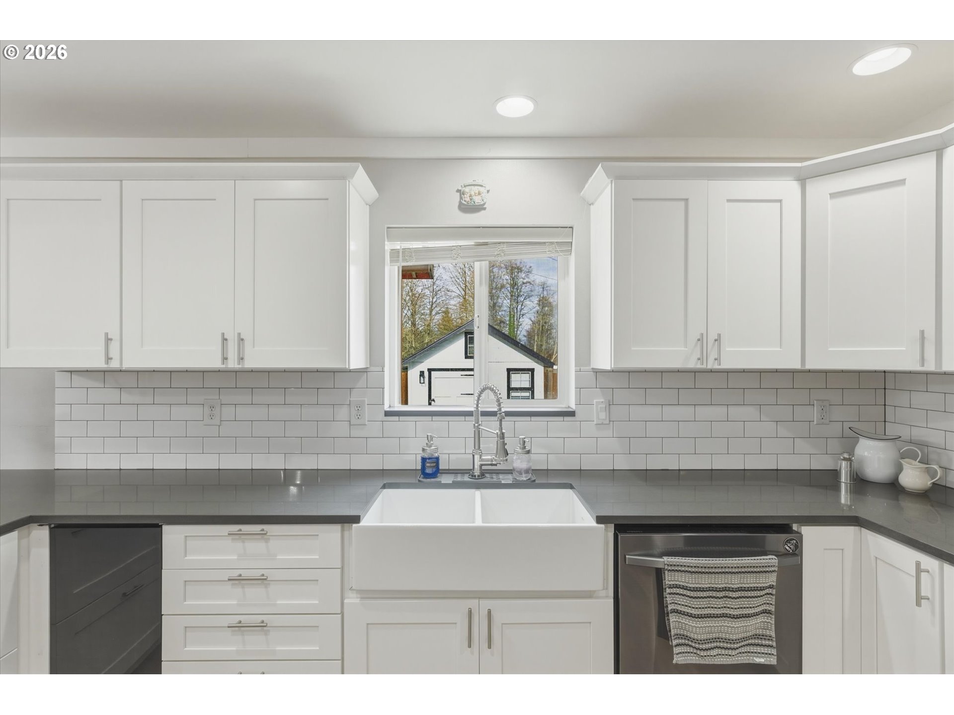 232 Shoreview Drive Kelso, WA 98626 - Photo 13 of 43 a kitchen with a sink cabinets and window