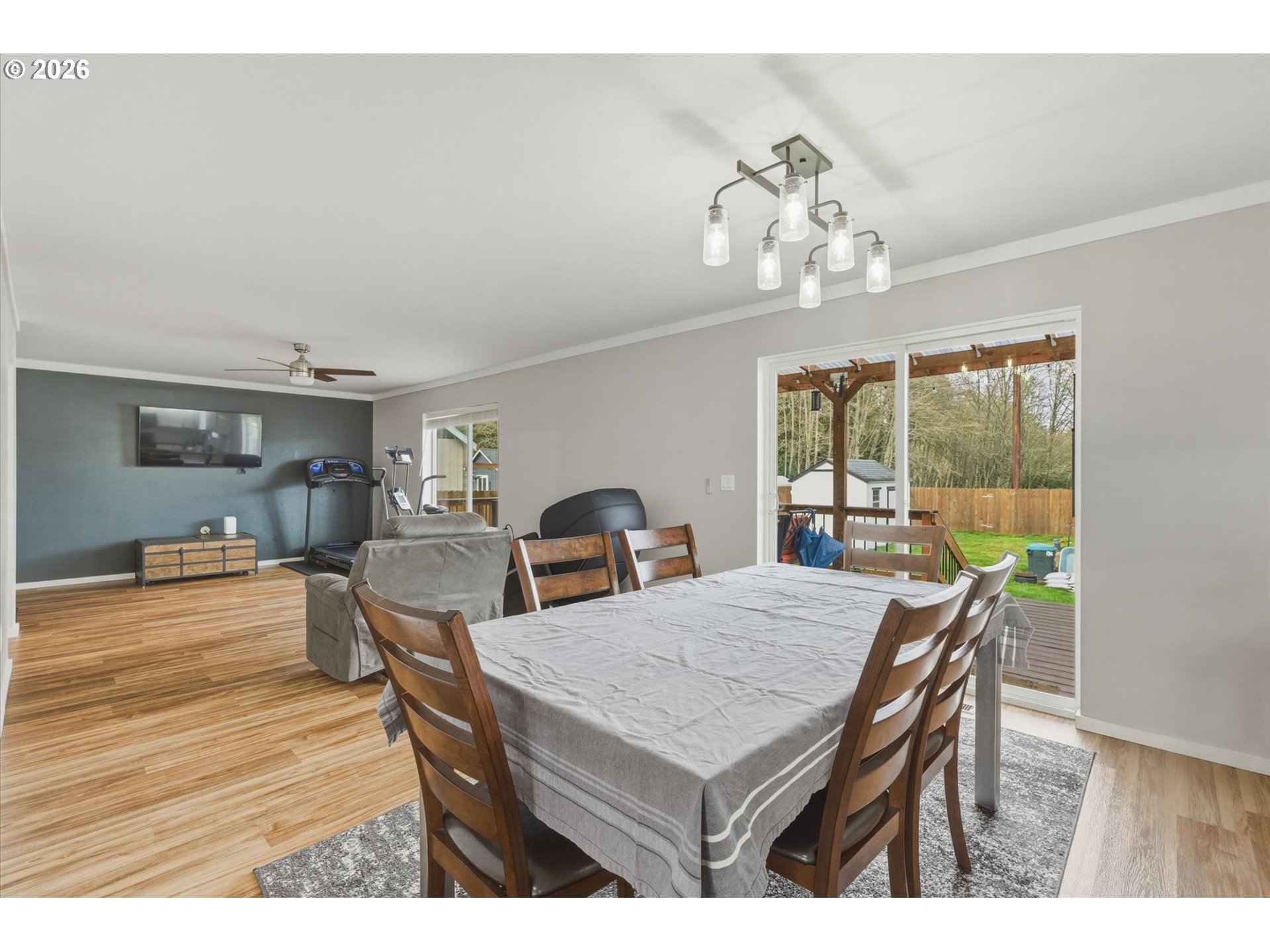 232 Shoreview Drive Kelso, WA 98626 - Photo 16 of 43 a view of a dining room with furniture a chandelier and wooden floor