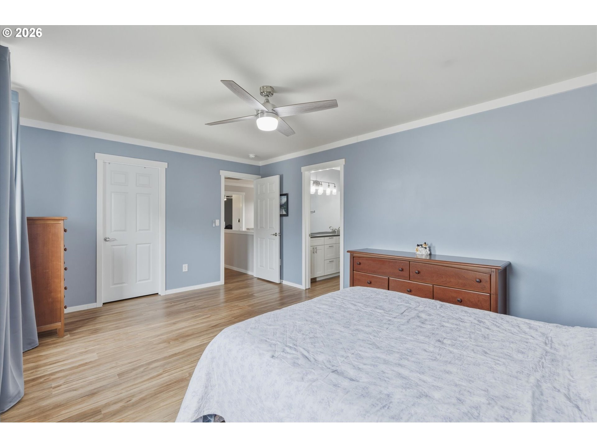 232 Shoreview Drive Kelso, WA 98626 - Photo 23 of 43 a bedroom with a bed and wooden floor