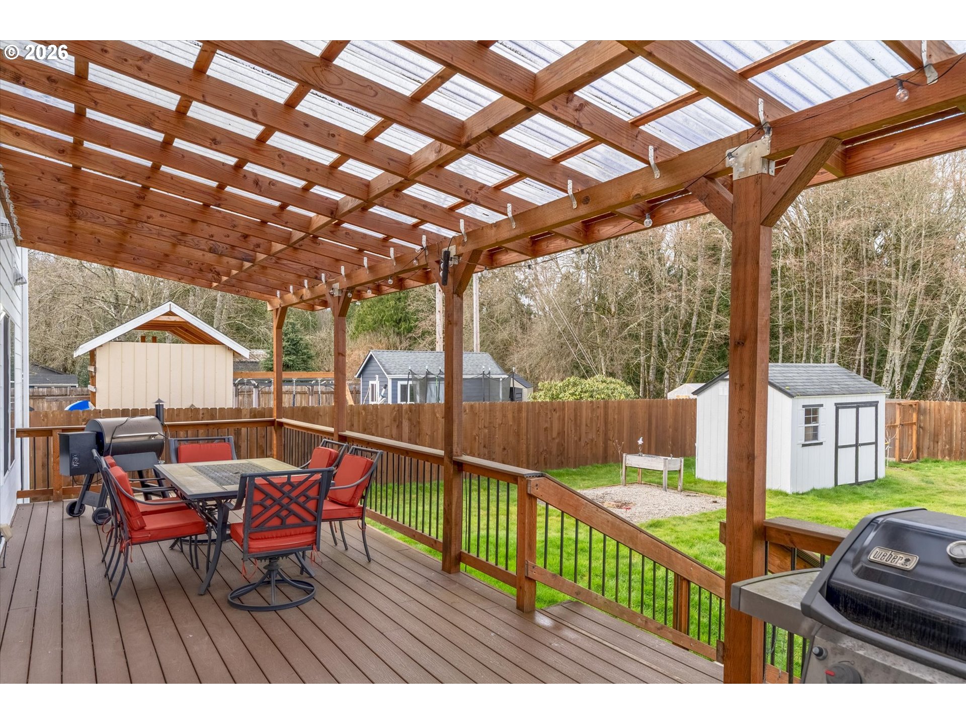 232 Shoreview Drive Kelso, WA 98626 - Photo 38 of 43 a view of a patio with table and chairs and wooden floor