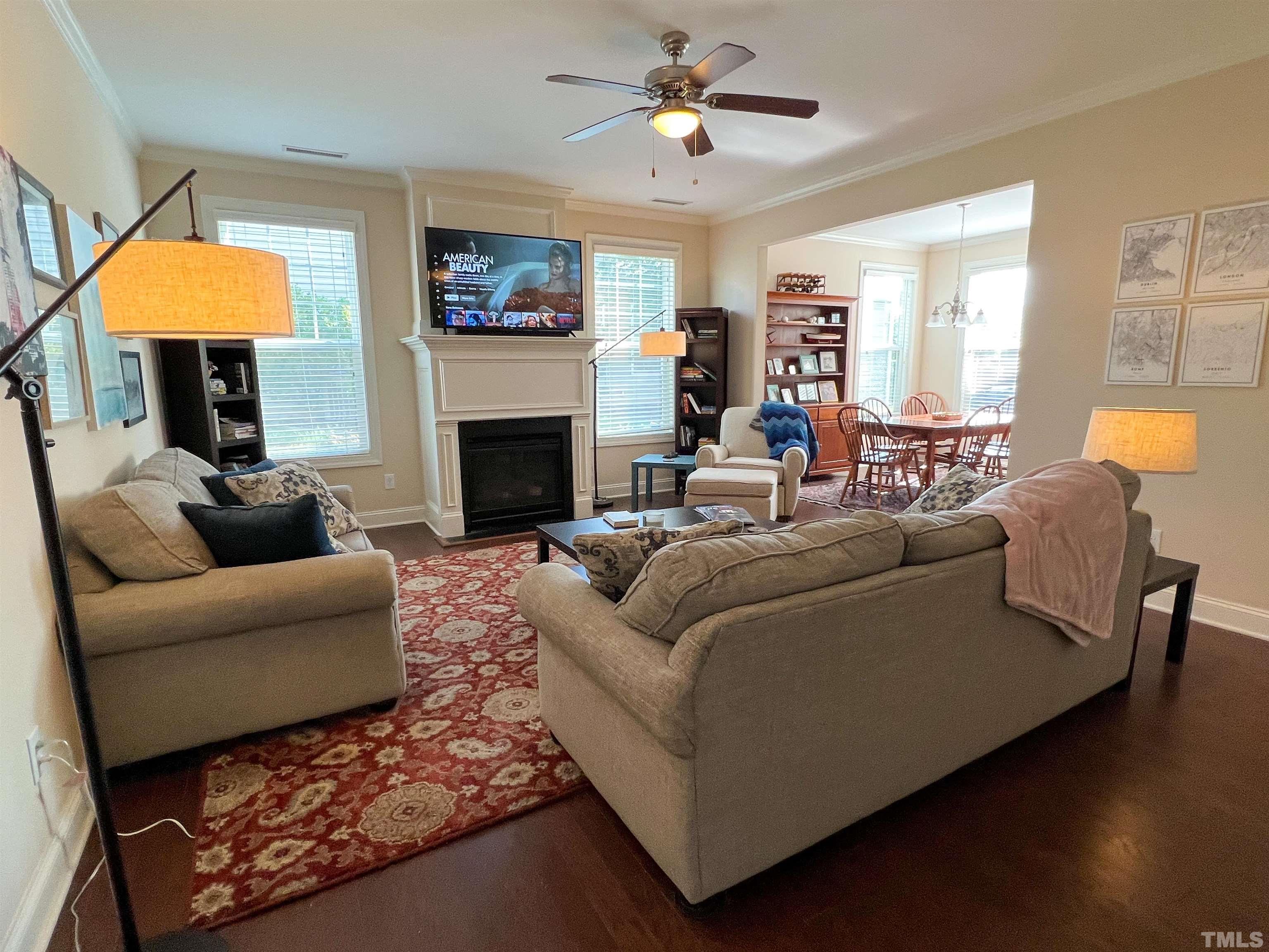 1108 Ileagnes Road Raleigh, NC 27603 - Photo 2 of 30 a living room with furniture a fireplace and a window