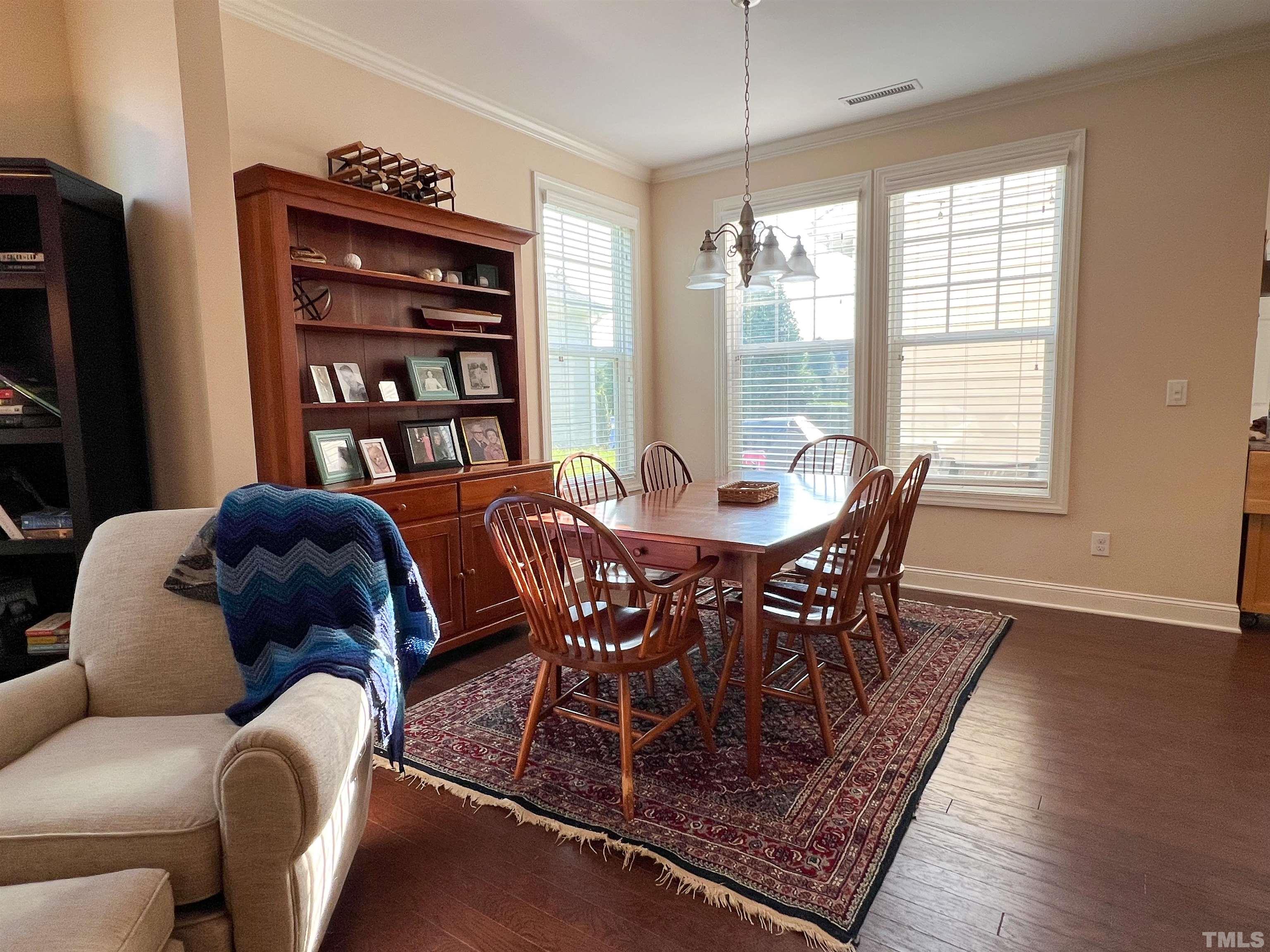 1108 Ileagnes Road Raleigh, NC 27603 - Photo 3 of 30 a view of a dining room with furniture and a window