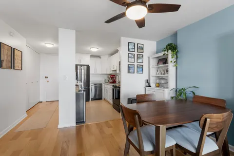 a view of a dining room with furniture and wooden floor