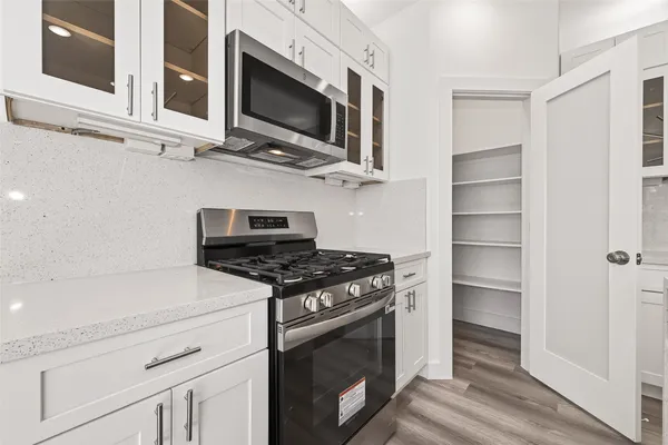 a kitchen with a refrigerator and countertop