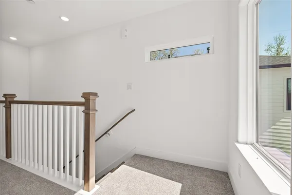 an empty room with white walls