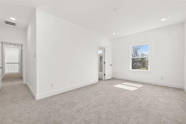 an empty room with a bathroom