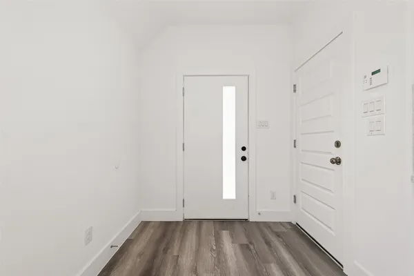 a kitchen with a sink a counter top space stainless steel appliances and a window