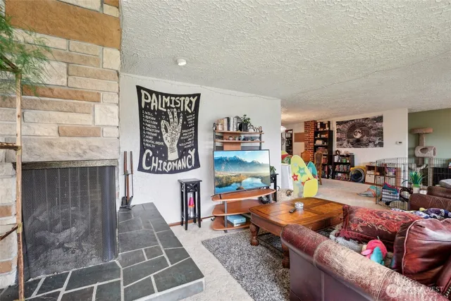 a living room with furniture and a table