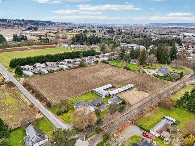 a picture of a room with a white wall and white refrigerator