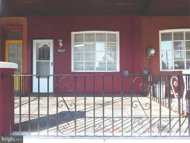 a view of a front door and outdoor seating