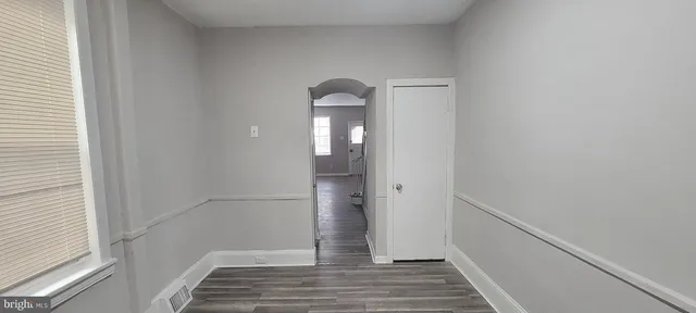 a view of a room with wooden floor and staircase