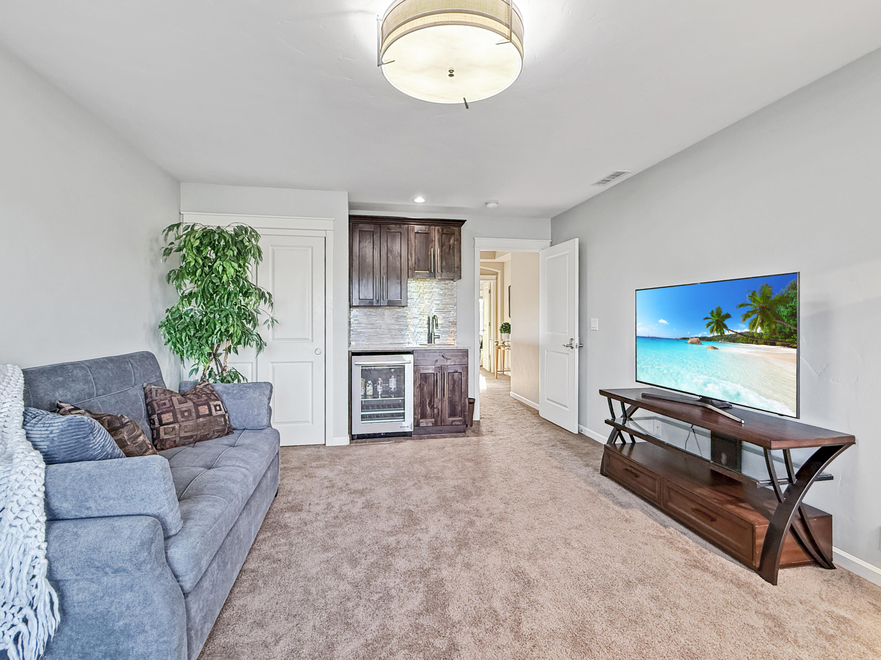 61072 Manhae Loop Bend, OR 97702 - Photo 29 of 63 a living room with furniture and a flat screen tv