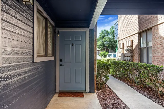a view of a door and wooden floor