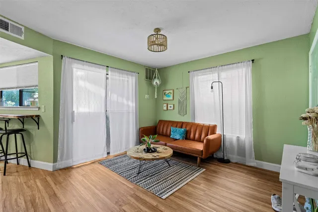 a living room with furniture and a rug
