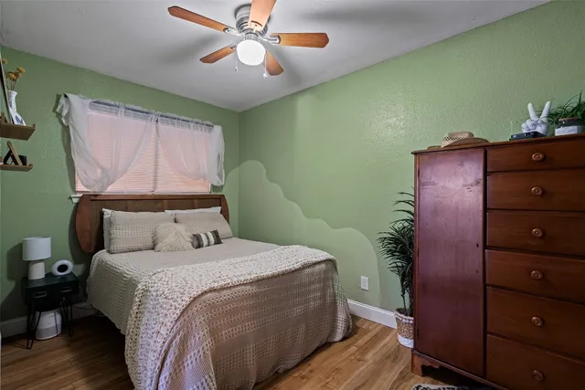 a bed room with a bed and a chandelier