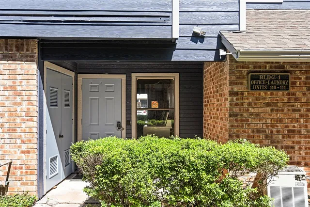 a view of a house with swimming pool and sitting area