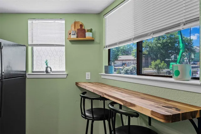 a view of a dining room with furniture window and outside view