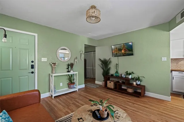 a living room with furniture and a table