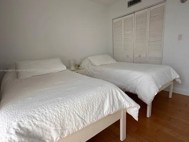 a view of hallway with bathroom