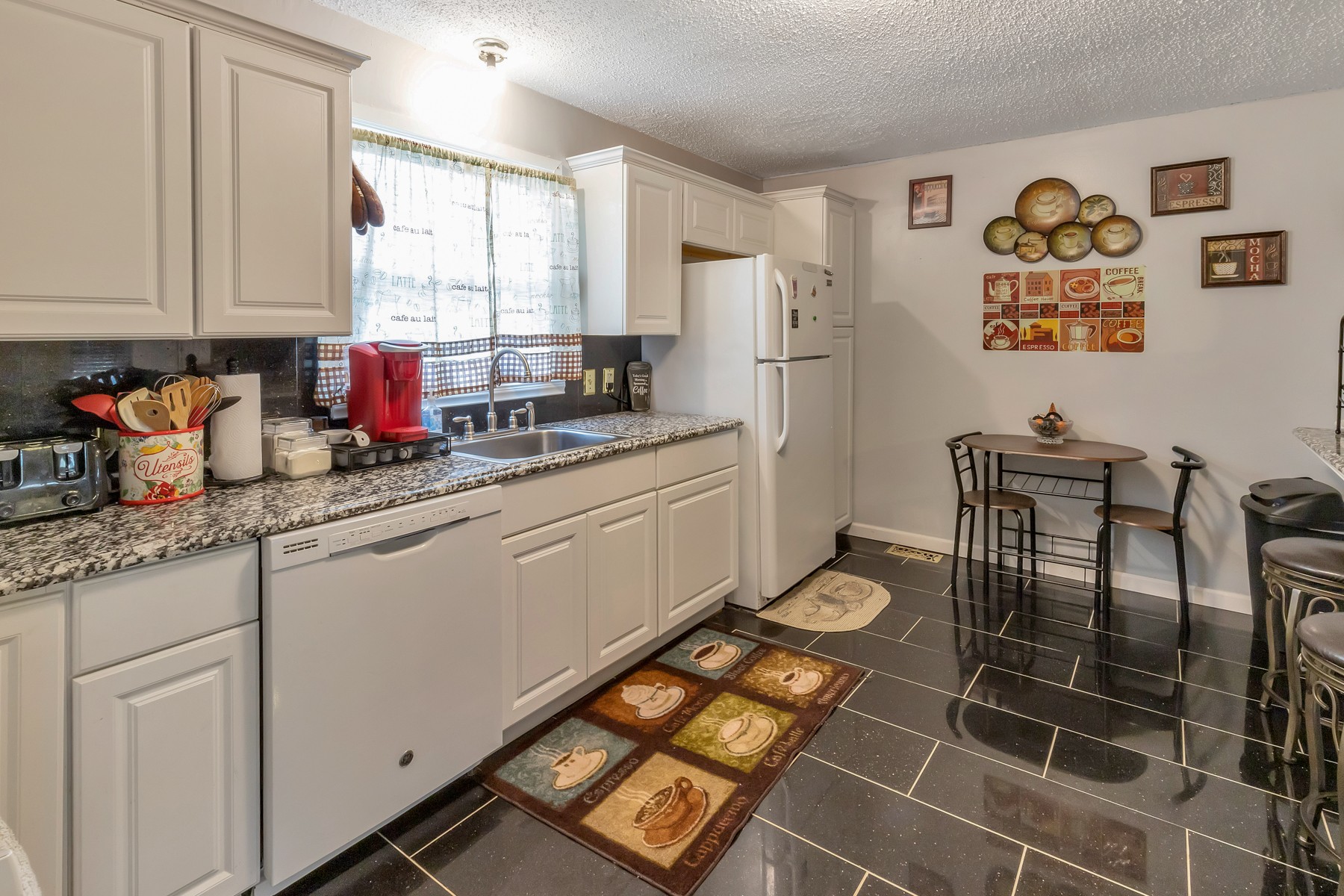 5970 South Lamont Road Springfield, TN 37172 - Photo 5 of 15 a kitchen with stainless steel appliances granite countertop a stove a sink and a refrigerator