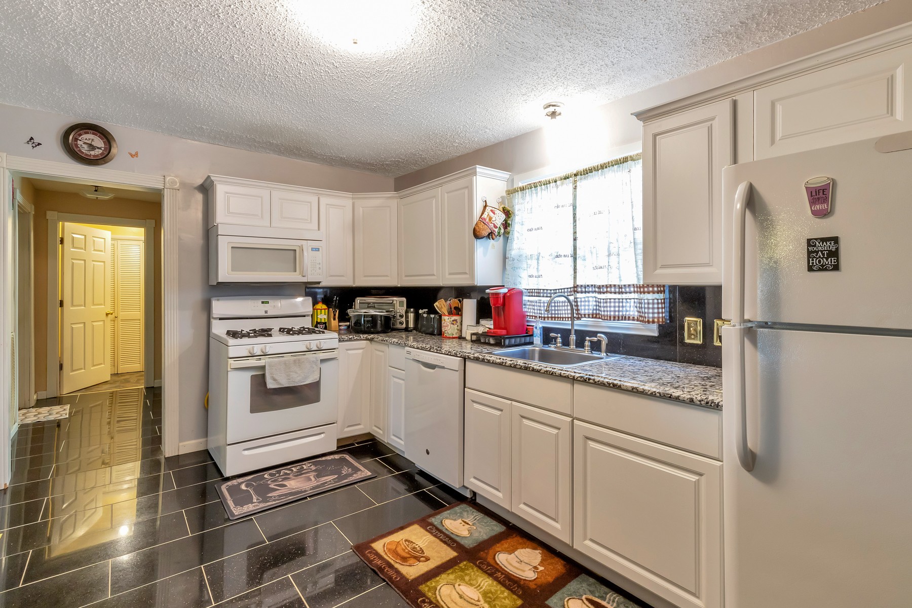 5970 South Lamont Road Springfield, TN 37172 - Photo 6 of 15 a kitchen with stainless steel appliances granite countertop a refrigerator sink and cabinets