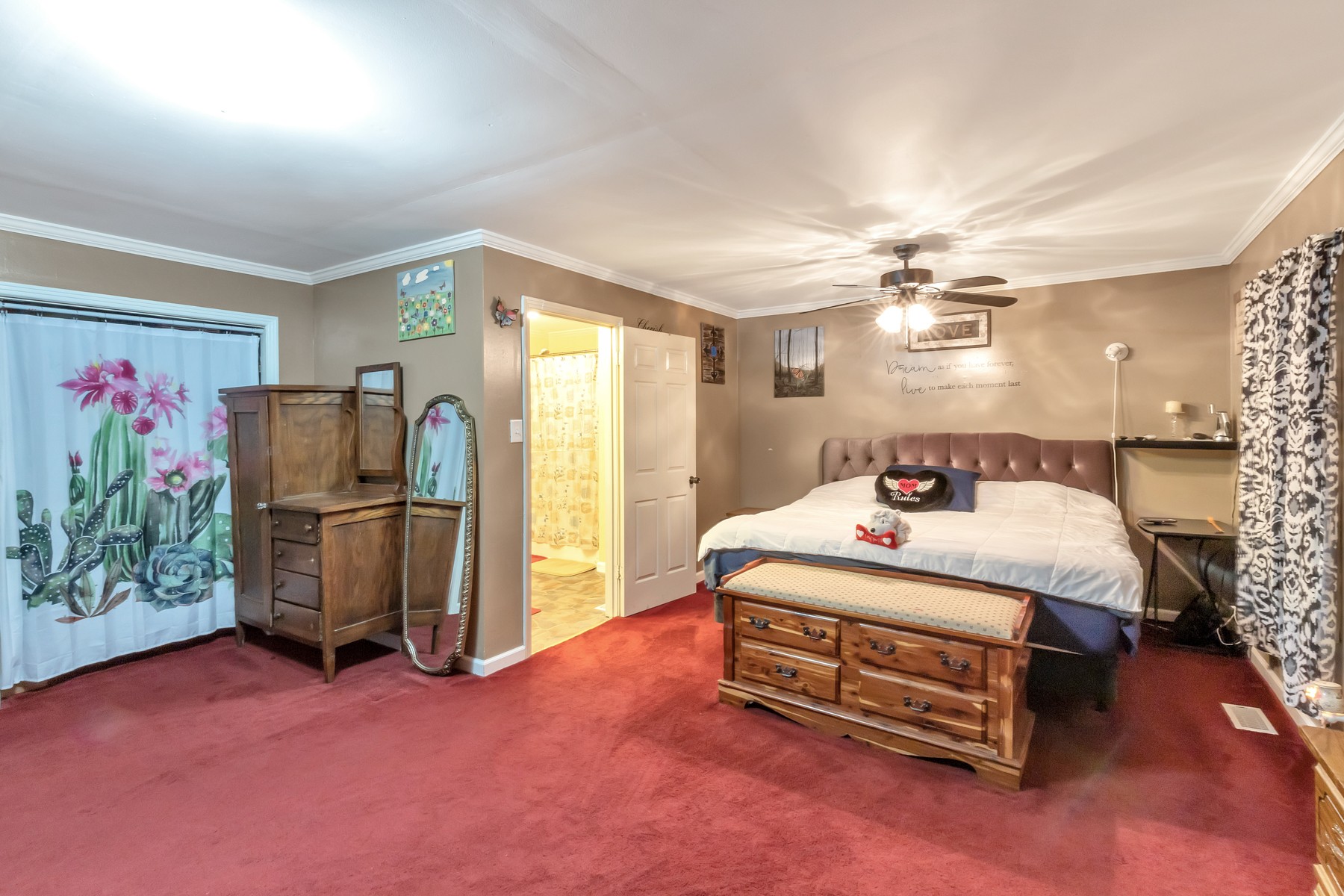 5970 South Lamont Road Springfield, TN 37172 - Photo 8 of 15 a spacious bedroom with a bed and a chandelier