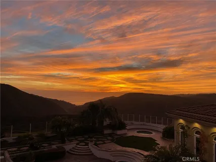 a view of an ocean and a mountain