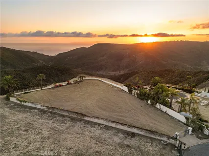 a view of an ocean and city