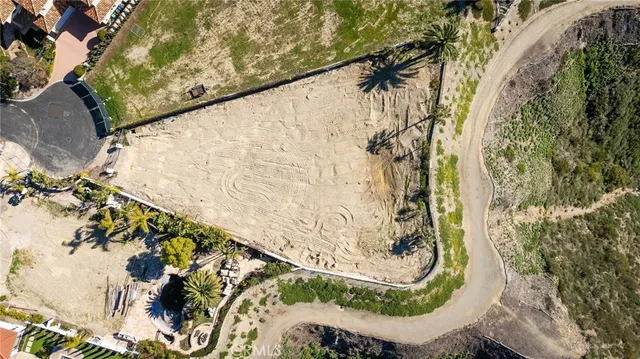 a view of painting on the wall and covered with wooden fence