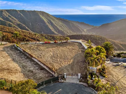 a view of ocean and a mountain
