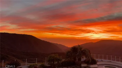 a view of balcony with sunset
