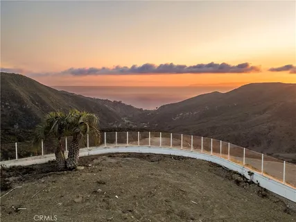 a view of a house with a ocean view